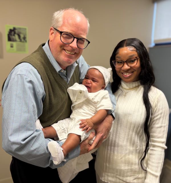 Benjamin Doolittle, M.D., M.Div., pictured with baby Jrue and his mother Sharline.